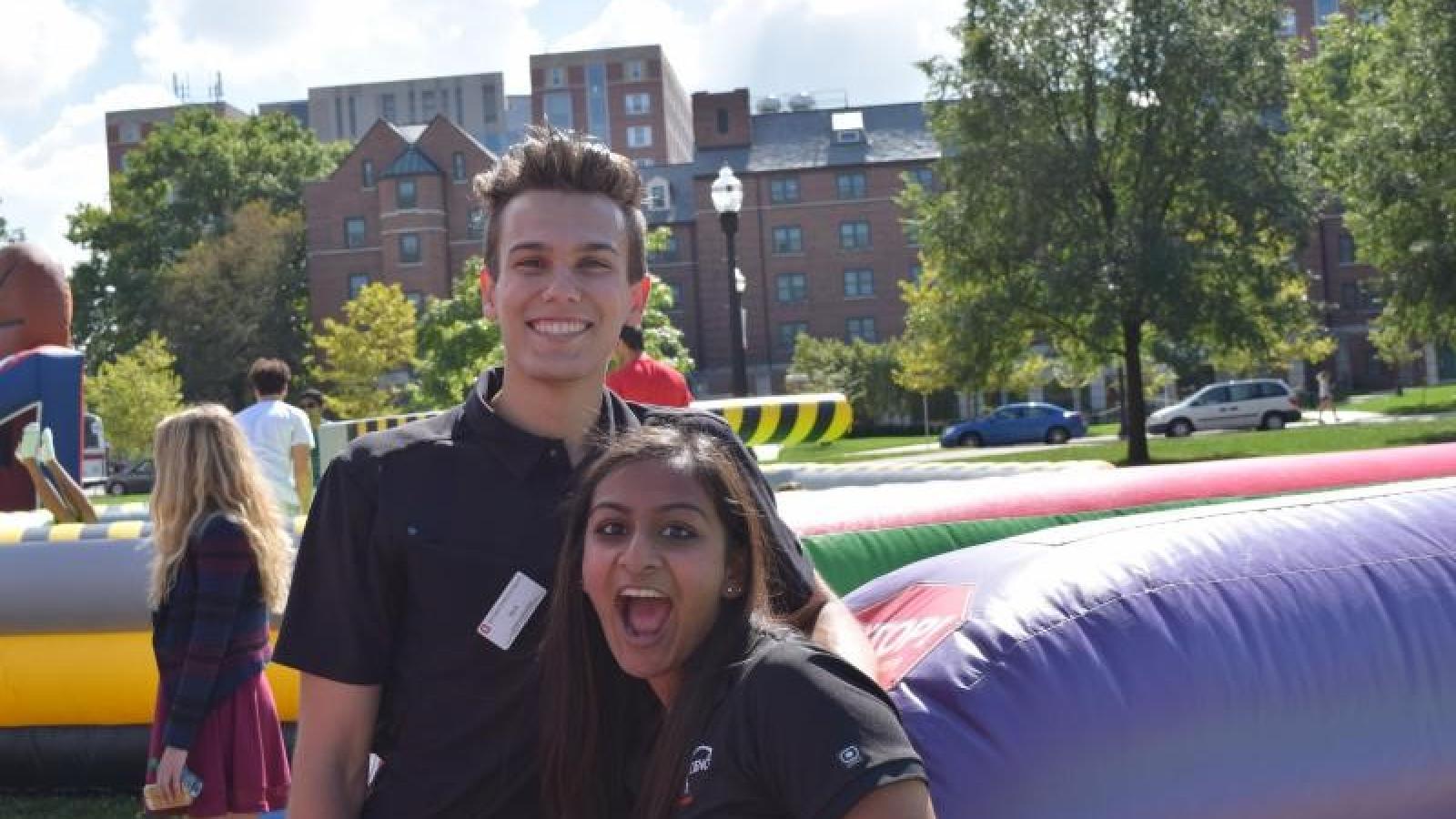 Two Students in front of inflatable at field day
