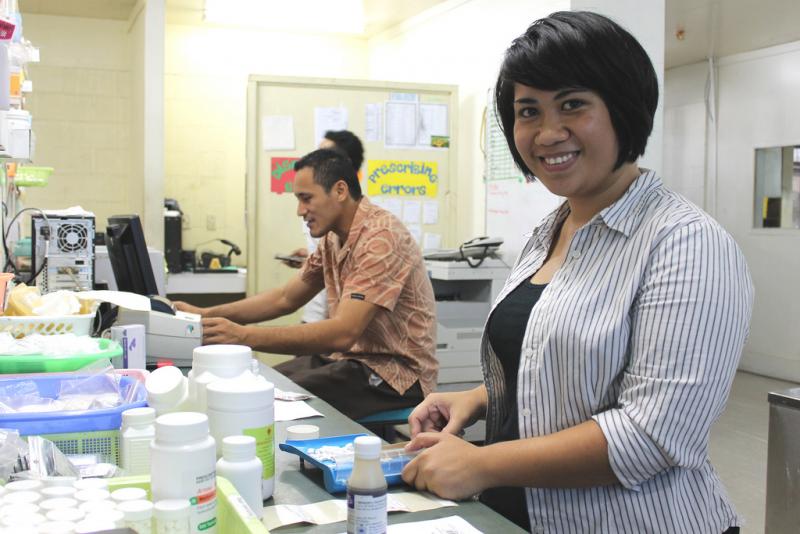 Pharmacist sorting medicine