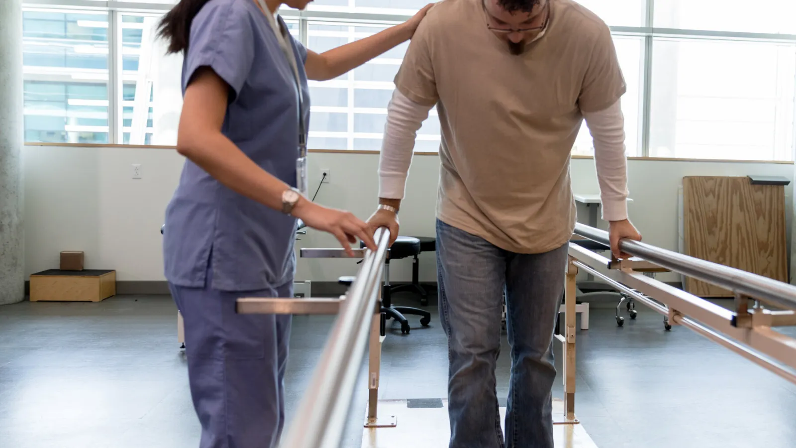 Physical Therapist helping a patient.