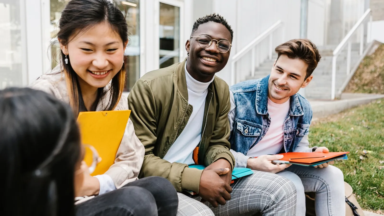 Three students laughing 