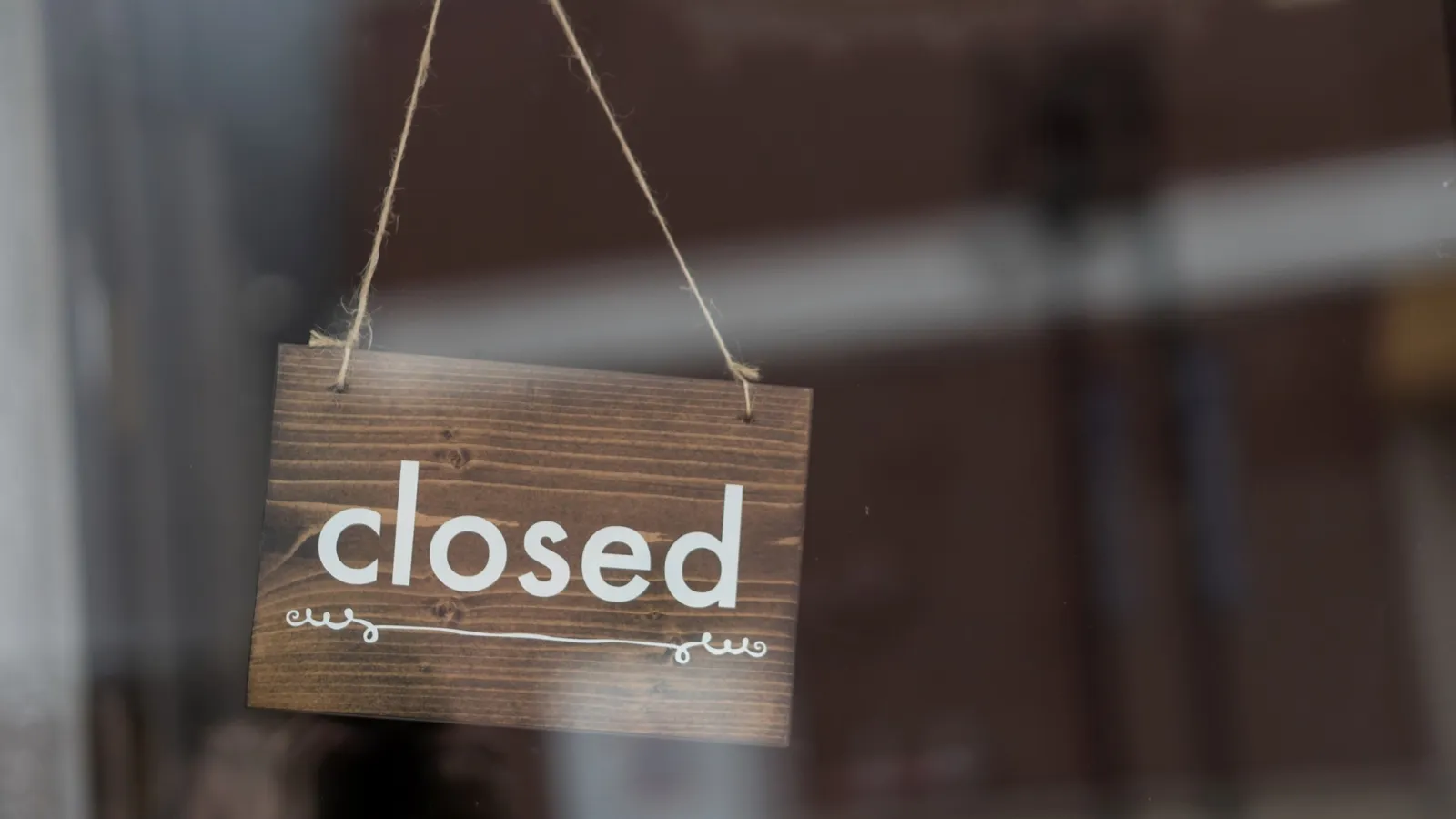  closed sign in a door window