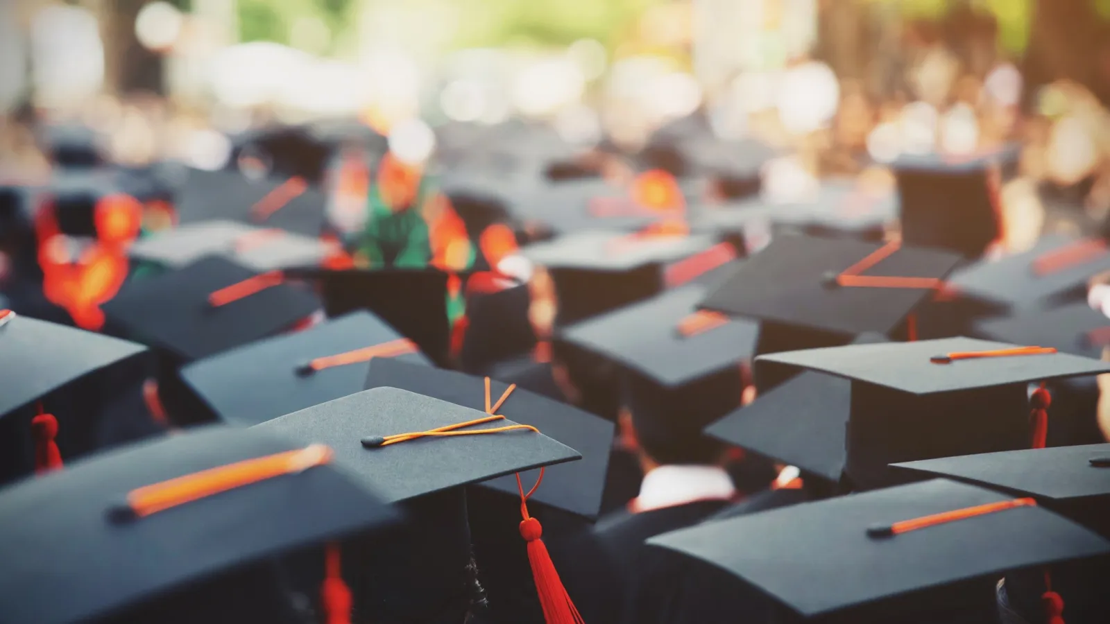 graduates wearing graduation mortars 