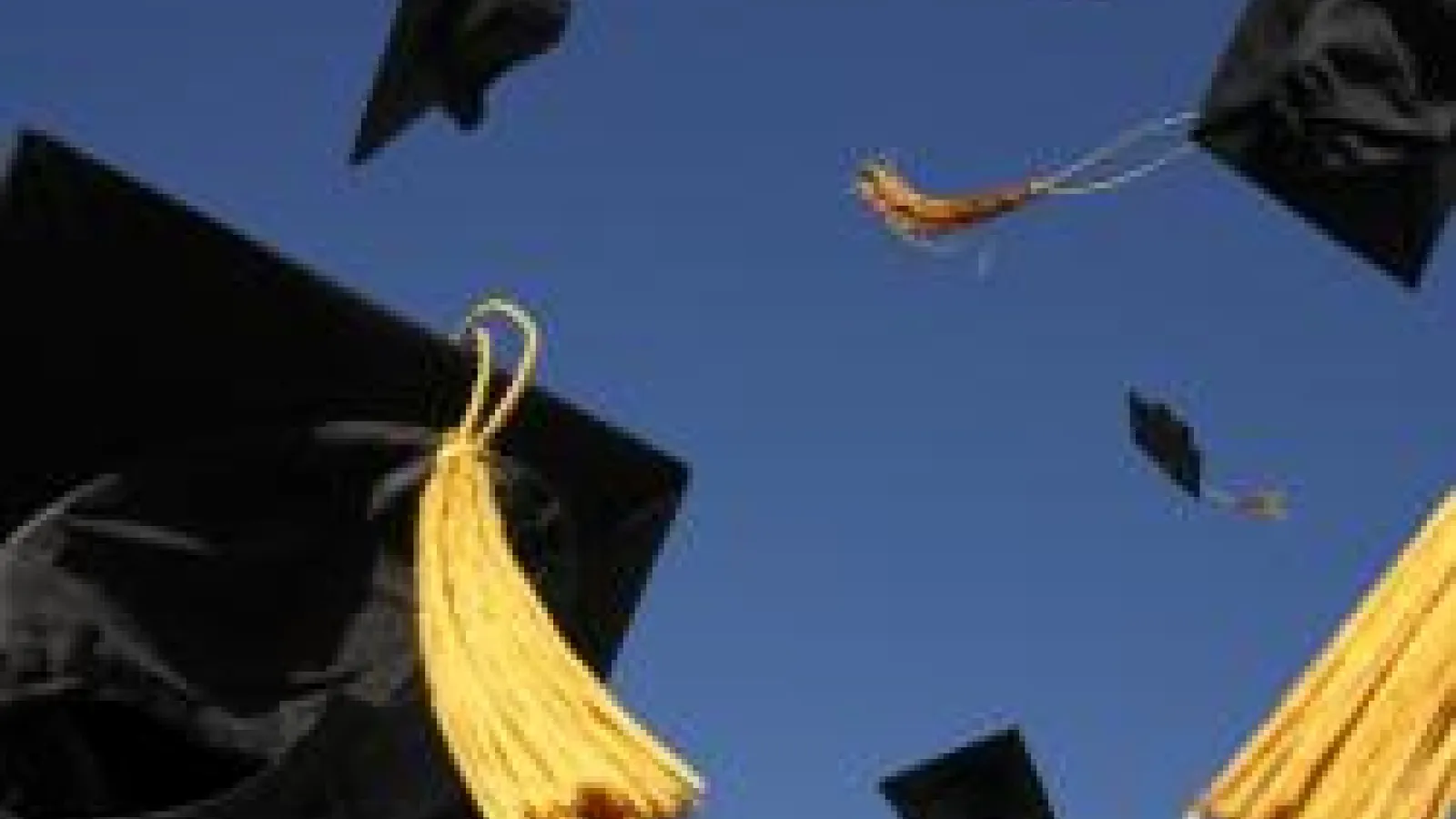 Photo of Graduation Caps in the air