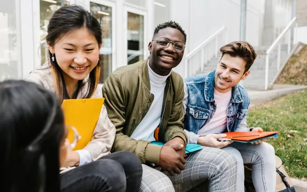 Three students laughing 